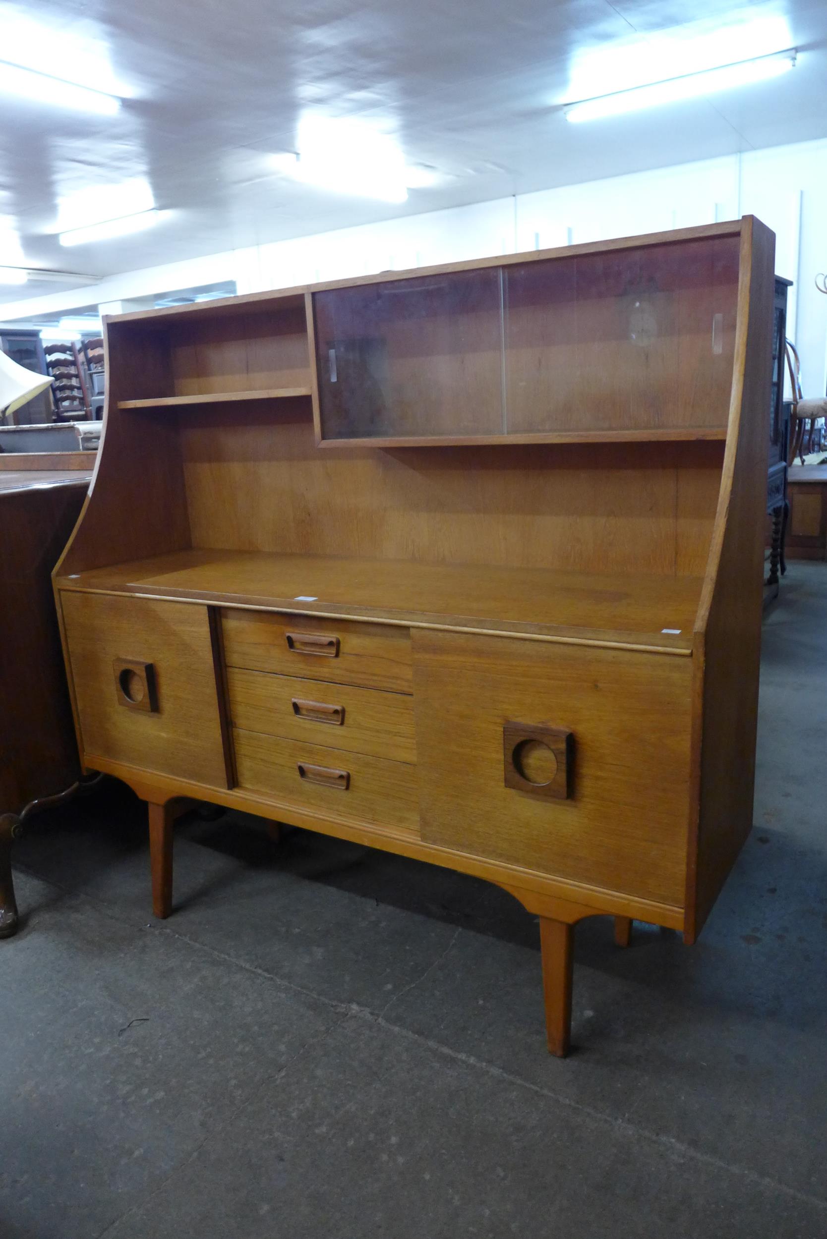 A teak highboard