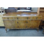 A Queen Anne style walnut sideboard