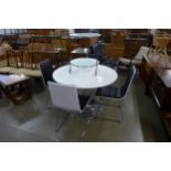 A chrome and white laminate circular table, four chairs and a trolley