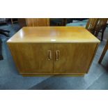 A G-Plan Fresco teak two door cabinet and a teak nest of tables