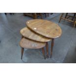 An Ercol elm and beech pebble shaped nest of tables