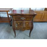 A French floral marquetery inlaid mahogany and gilt metal mounted bombe shaped petit commode