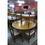 A McIntosh teak extending dining table and six chairs