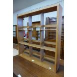 A Beaver & Tapley beech wall mounted Penguin bookcase