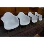 A set of four Eames style beech and white plastic chairs