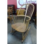 An Ercol Blonde elm and beech Chairmaker's rocking chair