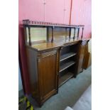 A Victorian Aesthetic Movement walnut breakfront bookcase