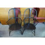 A pair of Ercol dark elm and beech Chairmaker armchairs