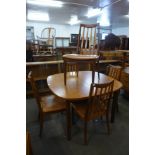 A G-Plan teak extending dining table and five chairs