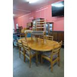 A G-Plan Fresco teak extending dining table and eight chairs