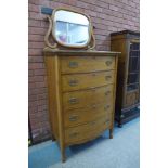 An early 20th Century French oak serpentine dressing chest