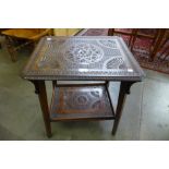 An Arts and Crafts chip carved oak occasional table