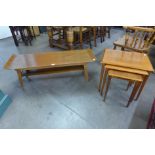 A teak coffee table and a nest of tables