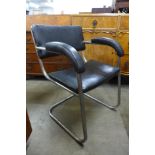 A Bauhaus style chrome and black vinyl cantilever armchair