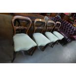 A set of four Victorian rosewood kidney back dining chairs