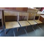 A vintage oak four seat folding bench