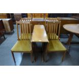 A teak drop-leaf table and four chairs