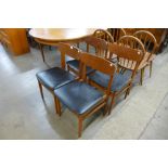 A set of four teak dining chairs