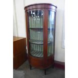 An Edward VII satinwood demi-lune display cabinet