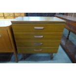 A teak chest of drawers