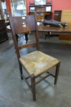 A Liberty & Co. style Arts and Crafts oak rush seated side chair