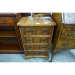 A small yew wood chest of drawers