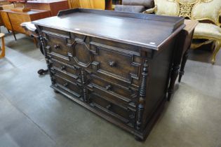 A Jacobean Revival oak geometric moulded chest of drawers