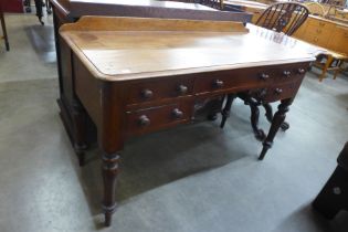 A Victorian mahogany writing table