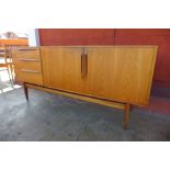 A McIntosh teak sideboard, extending dining table and six chairs