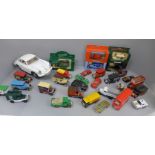 A collection of die-cast model vehicles, mainly advertising vans and a Burago Porsche