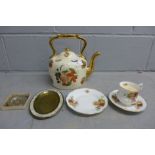 A decorative teapot, a trio and two dishes