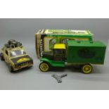 A John Deere Hawkeye clockwork truck, boxed and a Fiat Africa Safari 4x4 model vehicle