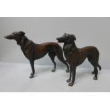 A pair of bronze models of lurcher dogs