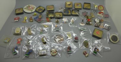 A collection of enamel and other badges