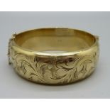 A gold plated silver bangle, 40g