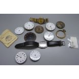 A collection of pocket watch movements, etc.