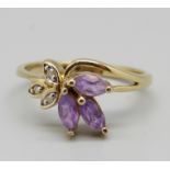 A 9ct gold ring set with amethyst and diamonds, 2.1g, N