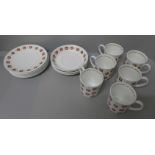 A Susie Cooper Apple Gay set of six cups, saucers and tea plates