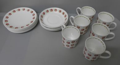 A Susie Cooper Apple Gay set of six cups, saucers and tea plates