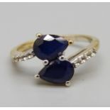 A silver gilt and sapphire ring, L