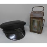 A Railway Guards peaked cap and a railway lantern