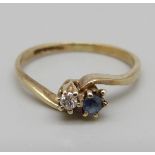 A 9ct gold, sapphire and diamond crossover ring, 1g, F