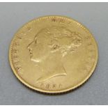 A Victorian 1871 half sovereign with shield back, die number 60