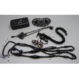 Victorian items; French jet hair clip, a long necklace, one other necklace, Albert chain, knot