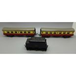 Two Tri-ang 00 gauge model railway carriages and a coal wagon