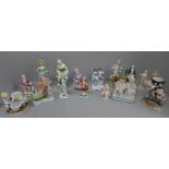 Sixteen German and continental figures including spill holders and pin cushion doll, some a/f