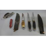 Three hunting knives, one by William Rodgers, and two multi-tool knives