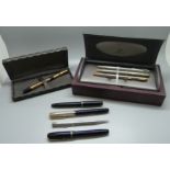 A black and gold plated Waterman pen with 18ct gold nib, three pens with 14ct gold nibs, Burnham