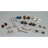 Eleven pairs of silver earrings