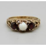 A 9ct gold, garnet and opal ring, 2.8g, O